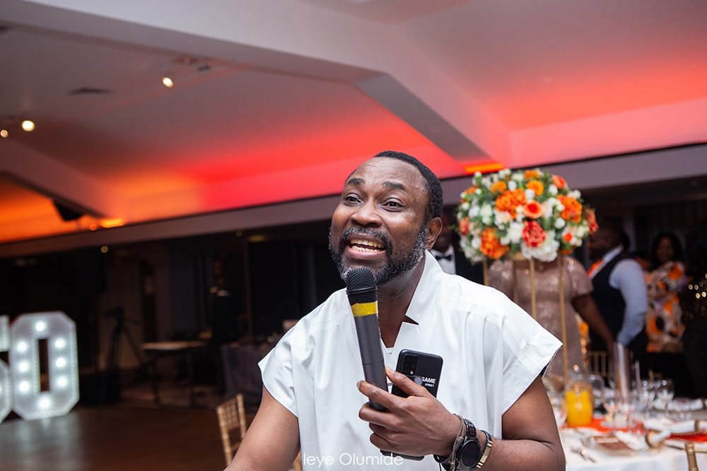 Professor Rhymes hosting an event with a microphone